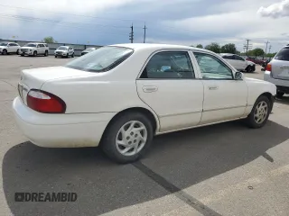 2000 Mazda 626 LX z VIN 1YVGF22C3Y5165341, wystawiony jako Copart lot #56575075 z przebiegiem 58 645 mil mil oraz Szkody całkowita. Historia ofert i sprzedaży dostępna na DreamBid. Obrazek 3.