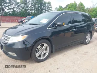 2011 Honda Odyssey Touring with VIN 5FNRL5H90BB070472, listed as a IAAI auction lot 42367710 with 203,589 mi miles and . Bid and sale history available at DreamBid. Image 17.
