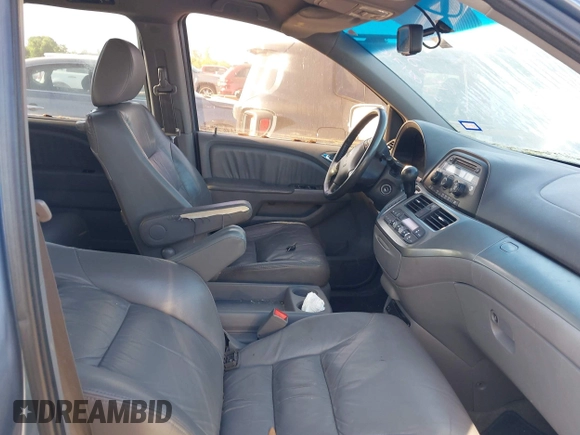 2009 Honda Odyssey EX-L with VIN 5FNRL38759B001130, listed as a IAAI auction lot 42004710 with 142,126 mi miles and . Bid and sale history available at DreamBid. Image 5.