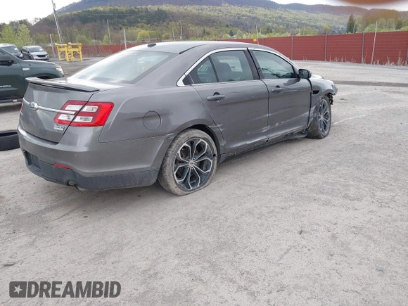2014 Ford Taurus SHO with VIN 1FAHP2KTXEG160800, listed as a IAAI auction lot 42083237 with 75,048 mi miles. Bid and sale history available at carsss.com. Image 4.