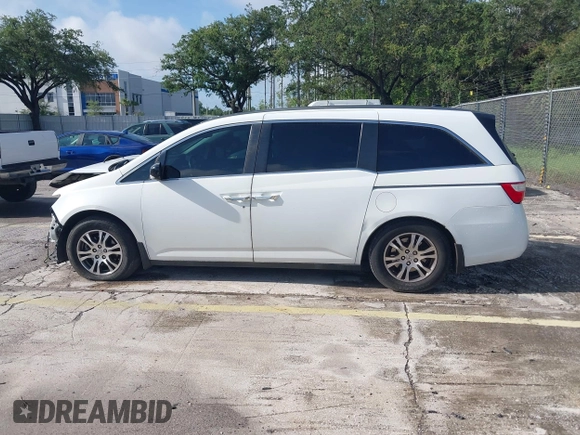 2012 Honda Odyssey EX-L z VIN 5FNRL5H61CB032353, wystawiony jako IAAI lot #42471691 z przebiegiem 186 257 mil mil oraz . Historia ofert i sprzedaży dostępna na DreamBid. Obrazek 14.