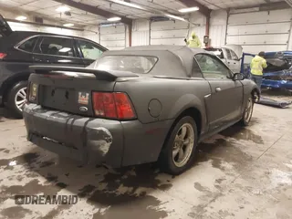 2002 Ford Mustang GT Deluxe z VIN 1FAFP45X92F176117, wystawiony jako IAAI lot #41619448 z przebiegiem 178 787 mil mil oraz . Historia ofert i sprzedaży dostępna na DreamBid. Obrazek 4.
