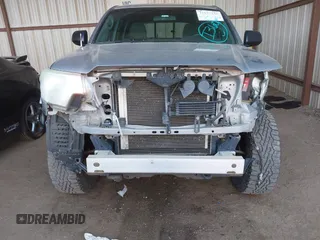 2014 Toyota Tacoma with VIN 3TMLU4EN3EM162738, listed as a IAAI auction lot 41871226 with 135,318 mi miles and . Bid and sale history available at DreamBid. Image 6.