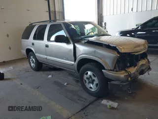 2004 Chevrolet Blazer LS z VIN 1GNDT13X44K102362, wystawiony jako IAAI lot #41944259 z przebiegiem 119 296 mil mil oraz . Historia ofert i sprzedaży dostępna na DreamBid. Obrazek 1.