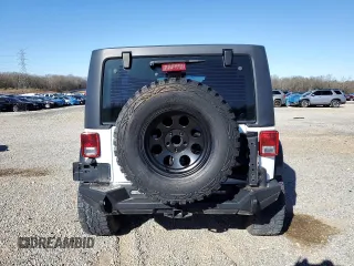 2012 Jeep Wrangler Unlimited Sport with VIN 1C4BJWDG2CL257437, listed as a Copart auction lot 49257965 with 141,695 mi miles and Clean title. Bid and sale history available at DreamBid. Image 6.