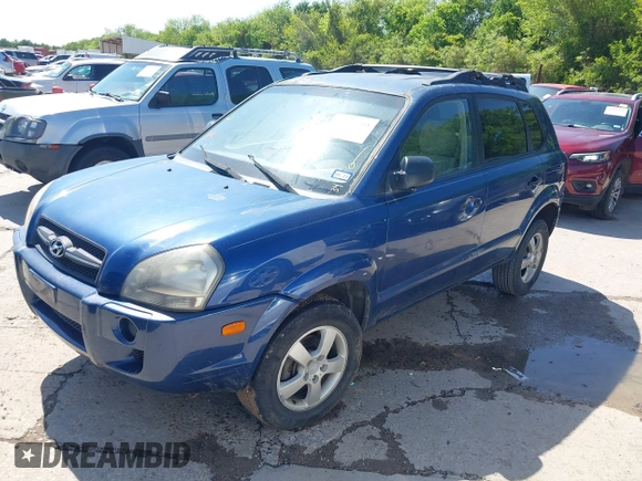 2006 Hyundai Tucson GL with VIN KM8JM12B06U386154, listed as a IAAI auction lot 41989899 with 168,069 mi miles. Bid and sale history available at carsss.com. Image 2.