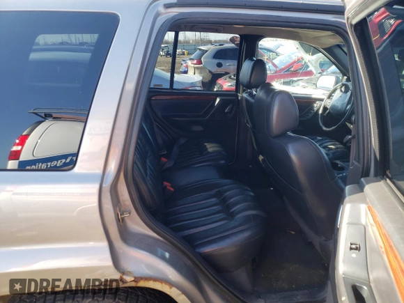 1999 Jeep Grand Cherokee Limited with VIN 1J4GW68N8XC770353, listed as a Copart auction lot 74670614 with Not provided miles and Non repairable. Bid and sale history available at DreamBid. Image 10.