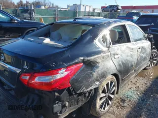 2016 Nissan Altima SV with VIN 1N4AL3AP0GC131985, listed as a IAAI auction lot 41191649 with 96,000 mi miles and . Bid and sale history available at DreamBid. Image 14.