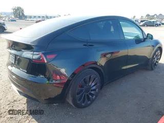 2023 Tesla Model Y Performance with VIN 7SAYGDEF4PF809308, listed as a IAAI auction lot 42056769 with 12,101 mi miles and . Bid and sale history available at DreamBid. Image 3.