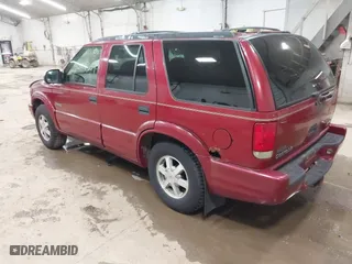 1999 Oldsmobile Bravada with VIN 1GHDT13W9X2701952, listed as a IAAI auction lot 42093184 with 121,532 mi miles. Bid and sale history available at carsss.com. Image 3.