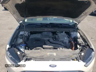 2015 Ford Fusion SE Hybrid z VIN 3FA6P0LU8FR105615, wystawiony jako Copart lot #61451155 z przebiegiem 106 778 mil mil oraz Szkoda całkowita • Salvage title. Historia ofert i sprzedaży dostępna na DreamBid. Obrazek 11.