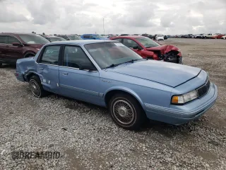 1993 Oldsmobile Cutlass Ciera S z VIN 1G3AG55N9P6451968, wystawiony jako Copart lot #72746634 z przebiegiem 88 151 mil mil oraz Szkody całkowita. Historia ofert i sprzedaży dostępna na DreamBid. Obrazek 4.