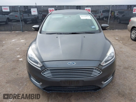 2018 Ford Focus Titanium with VIN 1FADP3J29JL232911, listed as a IAAI auction lot 41524078 with 90,764 mi miles and . Bid and sale history available at DreamBid. Image 12.