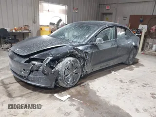 2025 Tesla Model 3 Long Range with VIN 5YJ3E1EA4SF913869, listed as a IAAI auction lot 41416608 with 1,141 mi miles and . Bid and sale history available at DreamBid. Image 2.
