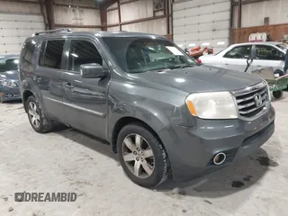2012 Honda Pilot Touring with VIN 5FNYF4H99CB052034, listed as a IAAI auction lot 42023430 with 137,428 mi miles. Bid and sale history available at carsss.com. Image 1.