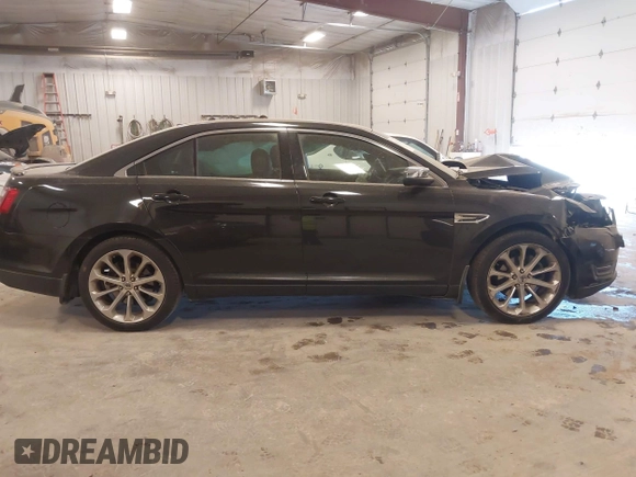 2014 Ford Taurus Limited z VIN 1FAHP2J88EG112614, wystawiony jako IAAI lot #42135220 z przebiegiem 70 409 mil mil oraz . Historia ofert i sprzedaży dostępna na DreamBid. Obrazek 13.