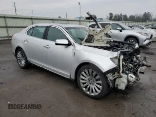 2015 Lincoln MKS with VIN 1LNHL9EK5FG607404, listed as a Copart auction lot 43246995 with Not provided miles and Salvage title. Bid and sale history available at DreamBid. Image 4.
