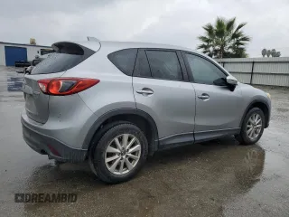 2015 Mazda CX-5 Touring with VIN JM3KE2CY4F0469096, listed as a Copart auction lot 48075105 with 131,788 mi miles and Salvage Title. Bid and sale history available at carsss.com. Image 3.
