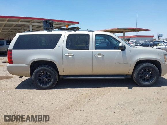 2013 Chevrolet Suburban LT with VIN 1GNSKJE70DR127208, listed as a IAAI auction lot 42285279 with 295,930 mi miles and . Bid and sale history available at DreamBid. Image 13.