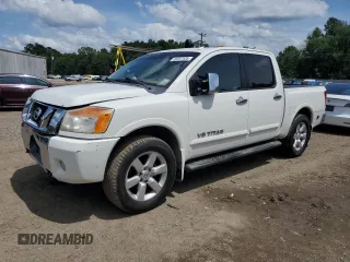 2010 Nissan Titan SE with VIN 1N6BA0ED1AN323167, listed as a Copart auction lot 60237535 with 135,182 mi miles and Salvage title. Bid and sale history available at DreamBid. Image 1.