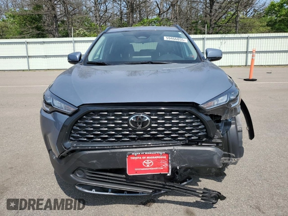 2023 Toyota Corolla Cross LE with VIN 7MUCAABG4PV054828, listed as a Copart auction lot 59466855 with 23,884 mi miles and Salvage title. Bid and sale history available at DreamBid. Image 5.