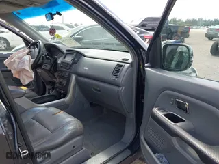 2005 Honda Pilot EX-L with NAVI with VIN 2HKYF18715H562492, listed as a IAAI auction lot 41627194 with 184,653 mi miles. Bid and sale history available at carsss.com. Image 5.