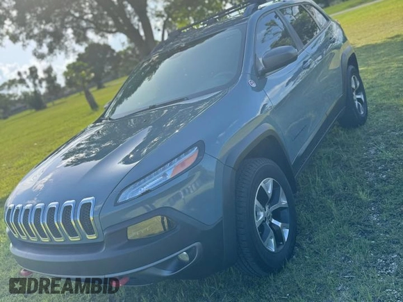 2015 Jeep Cherokee Trailhawk with VIN 1C4PJMBS1FW529559, listed as a Copart auction lot 66581755 with 113,915 mi miles and Salvage title. Bid and sale history available at DreamBid. Image 2.