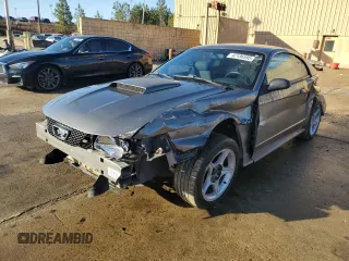2001 Ford Mustang GT Deluxe with VIN 1FAFP42XX1F237428, listed as a Copart auction lot 42136595 with 99,318 mi miles and Salvage Title. Bid and sale history available at carsss.com. Image 1.