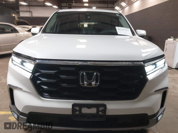 2023 Honda Pilot EX-L z VIN 5FNYG1H5XPB043275, wystawiony jako IAAI lot #41747522 z przebiegiem 18 865 mil mil oraz . Historia ofert i sprzedaży dostępna na DreamBid. Obrazek 6.