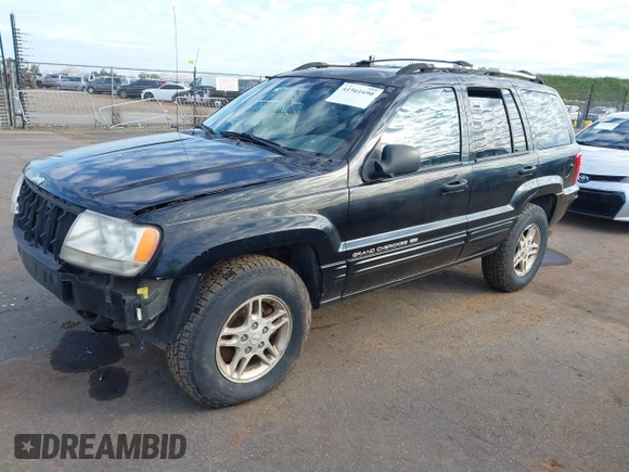 1999 Jeep Grand Cherokee Limited with VIN 1J4GW68NXXC637464, listed as a IAAI auction lot 41561690 with 235,728 mi miles. Bid and sale history available at carsss.com. Image 2.