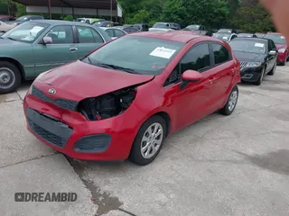 2015 Kia Rio LX with VIN KNADM5A34F6517123, listed as a IAAI auction lot 42125593 with 138,214 mi miles. Bid and sale history available at carsss.com. Image 2.