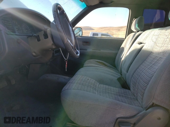 1995 Toyota T100 SR5 with VIN JT4VD12F1S0004904, listed as a Copart auction lot 75796804 with 182,011 mi miles and Salvage Title. Bid and sale history available at DreamBid. Image 7.