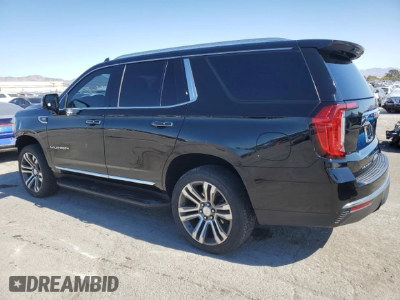 2021 GMC Yukon SLT with VIN 1GKS1BKDXMR119990, listed as a Copart auction lot 74733094 with 73,597 mi miles and Salvage Title. Bid and sale history available at carsss.com. Image 2.