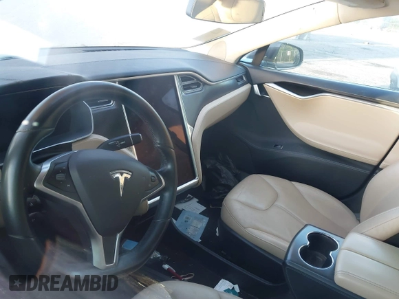 2014 Tesla Model S 60 z VIN 5YJSA1H19EFP51406, wystawiony jako IAAI lot #41561395 z przebiegiem Nie podano mil oraz . Historia ofert i sprzedaży dostępna na DreamBid. Obrazek 7.