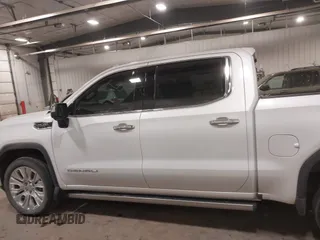 2020 GMC Sierra 1500 Denali z VIN 1GTU9FEL9LZ116486, wystawiony jako IAAI lot #41392384 z przebiegiem 61 283 mil mil oraz . Historia ofert i sprzedaży dostępna na DreamBid. Obrazek 14.