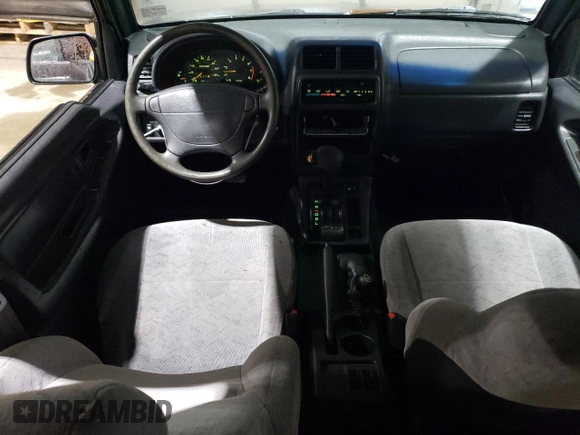 1998 Chevrolet Tracker z VIN 2CNBJ1362W6919635, wystawiony jako Copart lot #56894355 z przebiegiem 140 298 mil mil oraz Szkoda całkowita • Salvage title. Historia ofert i sprzedaży dostępna na DreamBid. Obrazek 8.