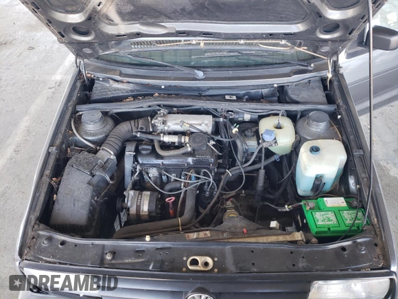 1989 Volkswagen Jetta z VIN WVWKB01G2KW684385, wystawiony jako Copart lot #49694065 z przebiegiem 63 792 mil mil oraz Czysty tytuł • Clean title. Historia ofert i sprzedaży dostępna na DreamBid. Obrazek 11.