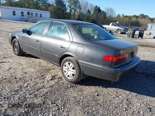 2001 Toyota Camry CE with VIN 4T1BG22K41U842473, listed as a IAAI auction lot 41858322 with 203,696 mi miles. Bid and sale history available at carsss.com. Image 3.