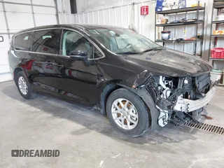2024 Chrysler Pacifica Touring L with VIN 2C4RC1BG2RR187100, listed as a IAAI auction lot 42602084 with 32,056 mi miles and . Bid and sale history available at DreamBid. Image 1.
