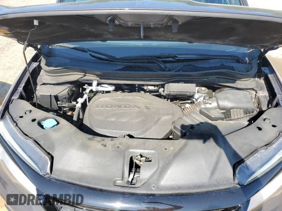 2021 Honda Passport Touring z VIN 5FNYF7H97MB011307, wystawiony jako Copart lot #52310415 z przebiegiem 72 118 mil mil oraz Szkoda całkowita • Salvage title. Historia ofert i sprzedaży dostępna na DreamBid. Obrazek 12.