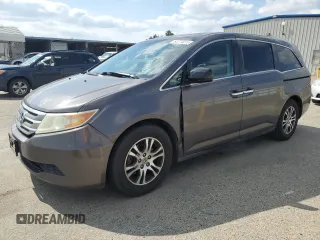 2011 Honda Odyssey EX-L with VIN 5FNRL5H61BB056652, listed as a Copart auction lot 54774015 with 233,125 mi miles and Salvage Title. Bid and sale history available at carsss.com. Image 1.
