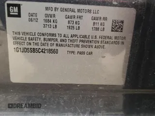2012 Chevrolet Sonic LT z VIN 1G1JD5SB5C4218560, wystawiony jako Copart lot #75256184 z przebiegiem 182 339 mil mil oraz Szkoda całkowita • Salvage title. Historia ofert i sprzedaży dostępna na DreamBid. Obrazek 13.