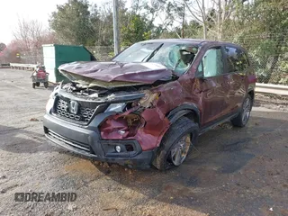 2021 Honda Passport EX-L with VIN 5FNYF7H55MB015305, listed as a IAAI auction lot 41672601 with 74,788 mi miles. Bid and sale history available at carsss.com. Image 2.