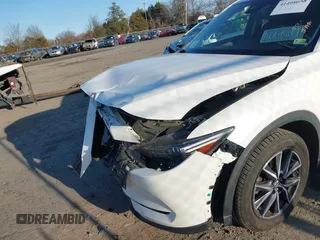2018 Mazda CX-5 S Premium with VIN JM3KFBDM8J1419006, listed as a IAAI auction lot 41498658 with 123,622 mi miles and . Bid and sale history available at DreamBid. Image 6.