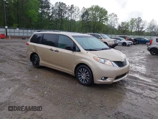 2014 Toyota Sienna XLE with VIN 5TDYK3DC1ES416999, listed as a IAAI auction lot 41972378 with 119,179 mi miles. Bid and sale history available at carsss.com. Image 1.