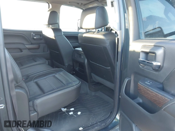 2017 GMC Sierra 2500HD Denali z VIN 1GT12UEG3HF132898, wystawiony jako IAAI lot #41442407 z przebiegiem 83 432 mil mil oraz . Historia ofert i sprzedaży dostępna na DreamBid. Obrazek 8.