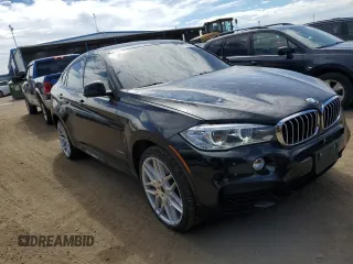 2015 BMW X6 xDrive50i with VIN 5UXKU6C5XF0F94498, listed as a Copart auction lot 67776034 with 106,579 mi miles and Non Repairable. Bid and sale history available at carsss.com. Image 4.