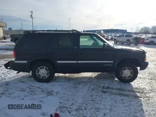 1999 GMC Jimmy SLE with VIN 1GKDT13W5X2520020, listed as a IAAI auction lot 41337936 with 277,615 mi miles. Bid and sale history available at carsss.com. Image 13.