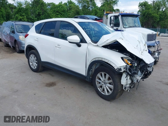 2014 Mazda CX-5 Touring z VIN JM3KE4CY9E0373359, wystawiony jako IAAI lot #42209277 z przebiegiem 106 493 mil mil oraz . Historia ofert i sprzedaży dostępna na DreamBid. Obrazek 1.