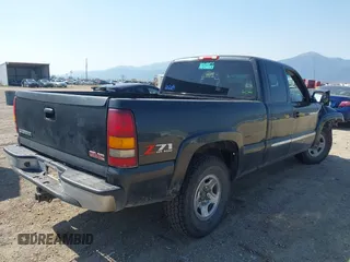 2003 GMC Sierra 1500 SLT z VIN 1GTEK19T03E191705, wystawiony jako IAAI lot #42145392 z przebiegiem Nie podano mil oraz . Historia ofert i sprzedaży dostępna na DreamBid. Obrazek 4.